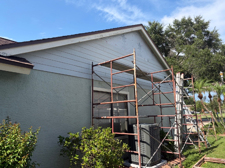 Image shows Central Florida home undergoing installation of new siding and stucco